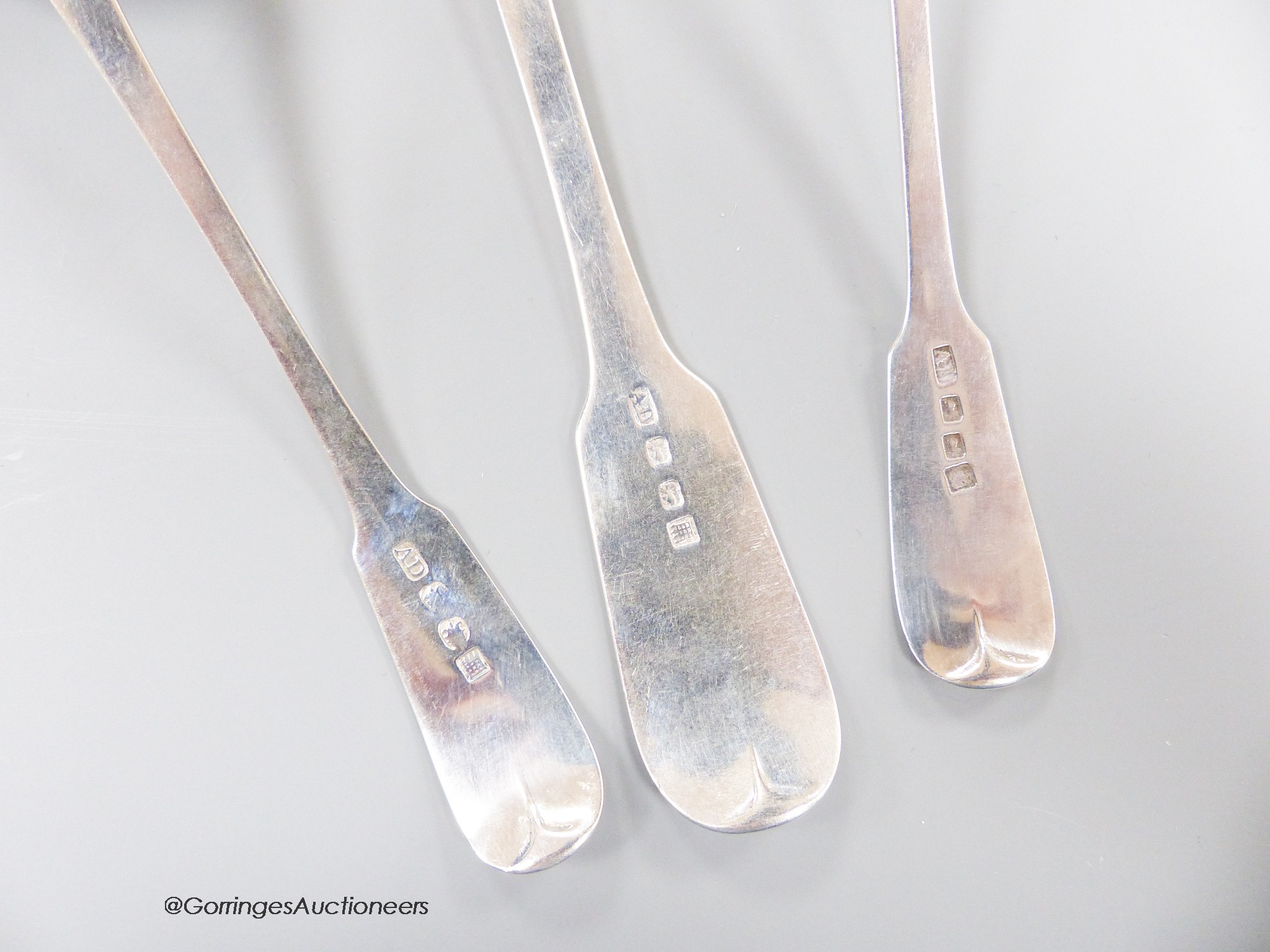 A 19th century Scottish provincial fiddle pattern table spoon, 22.3cm and two similar toddy ladles, Andrew Davidson, Arbroath, c.1835, 123 grams.